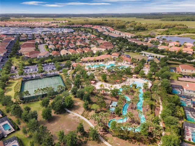 birds eye view of property featuring a residential view and a water view