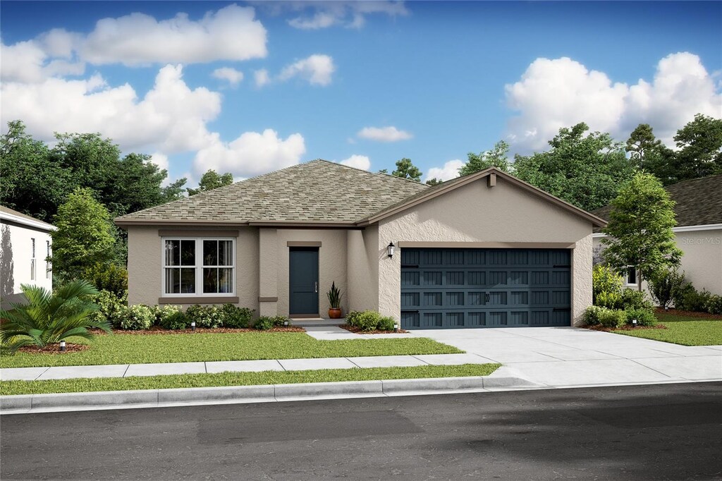 9 White House Dr Unit 39, Palm Coast, FL 32164 - single story home featuring an attached garage, driveway, stucco siding, a front yard, and a shingled roof