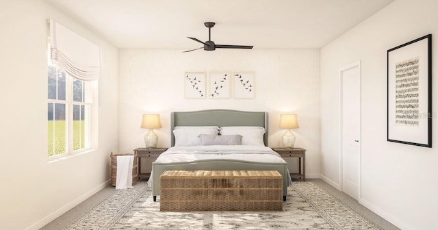 bedroom featuring baseboards, ceiling fan, and carpet