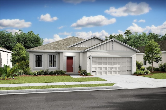 view of front facade with driveway, a front lawn, board and batten siding, an attached garage, and a shingled roof