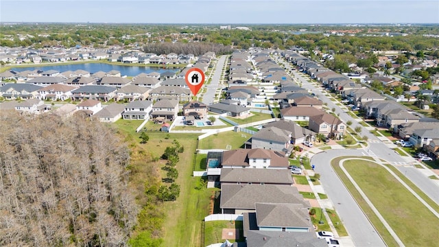 birds eye view of property with a residential view and a water view