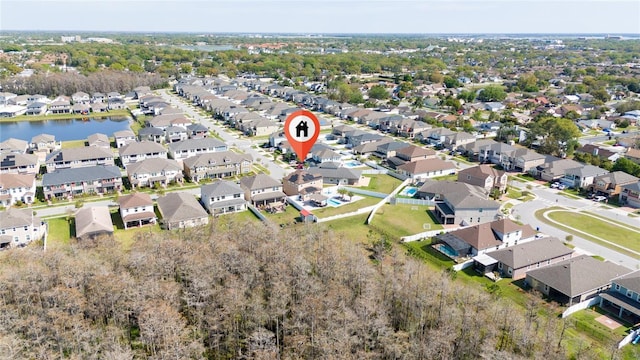 birds eye view of property featuring a residential view and a water view