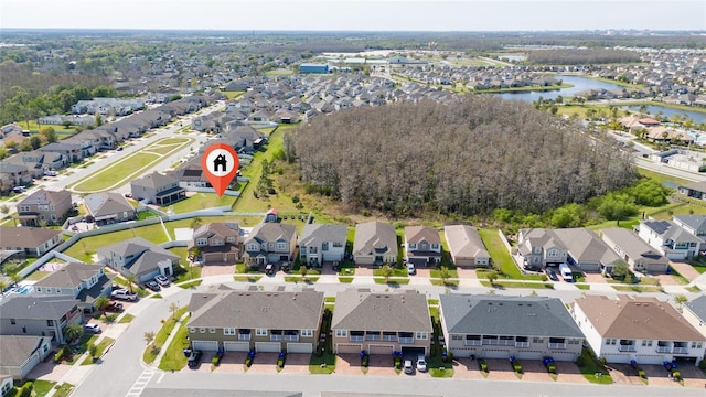 birds eye view of property featuring a residential view and a water view