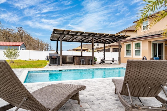 view of swimming pool featuring a fenced in pool, a fenced backyard, a pergola, a patio area, and outdoor dry bar