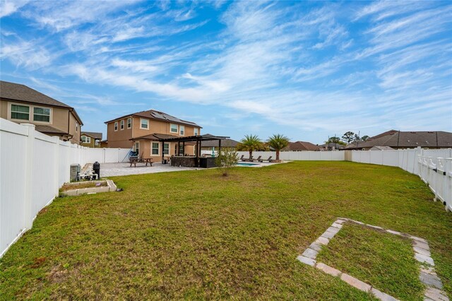 view of yard with a patio area and a fenced backyard