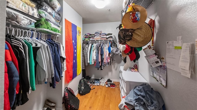 spacious closet with wood finished floors