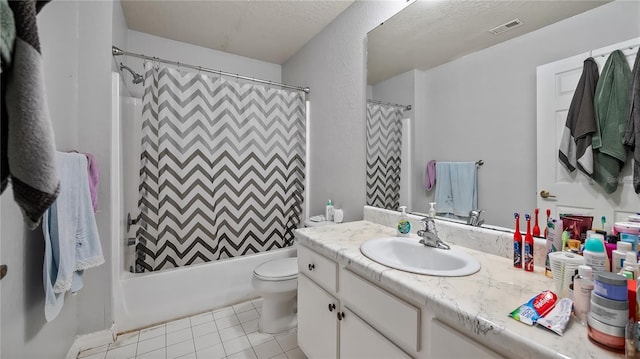 bathroom with vanity, visible vents, shower / bath combo, tile patterned floors, and toilet