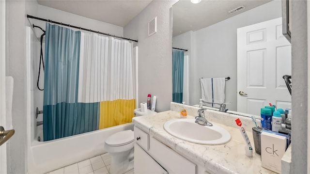 bathroom featuring tile patterned floors, visible vents, shower / bath combo with shower curtain, and vanity