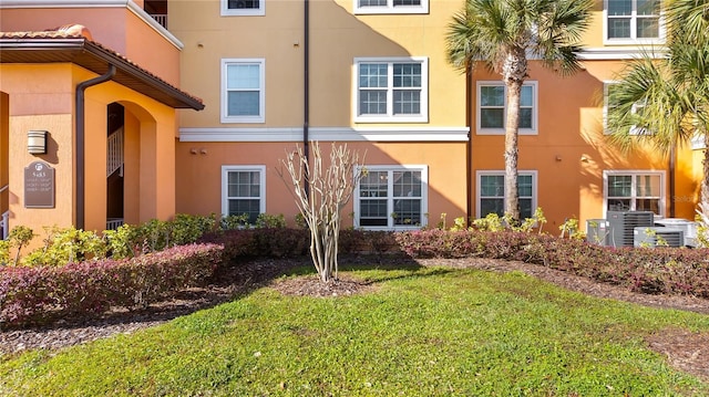 view of property exterior featuring a yard and stucco siding