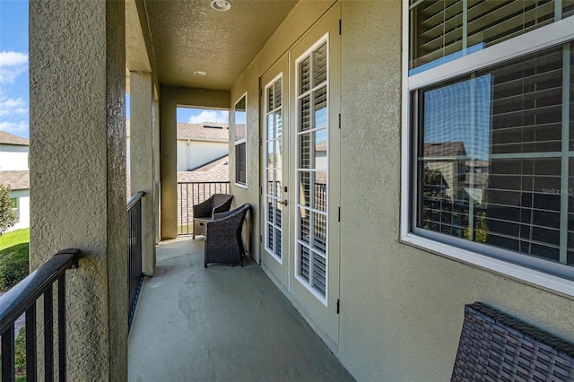 balcony featuring french doors