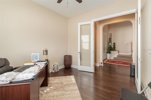 home office with dark wood-style floors, french doors, baseboards, and a ceiling fan