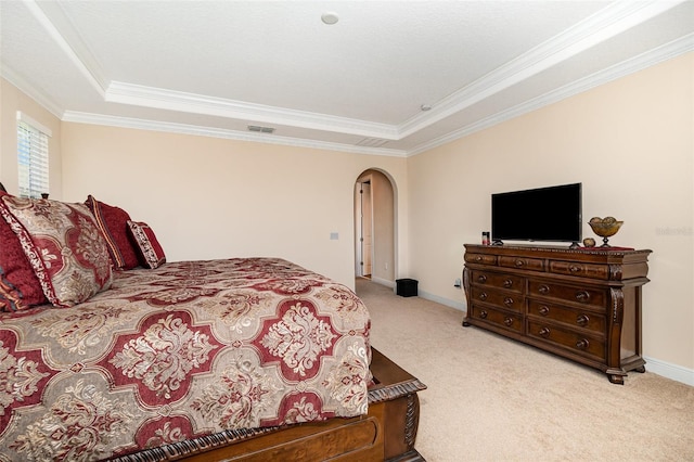 carpeted bedroom with arched walkways, visible vents, baseboards, and ornamental molding