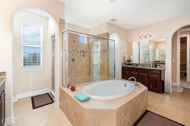 bathroom with tile patterned floors, visible vents, a garden tub, a shower stall, and vanity