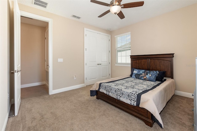 bedroom with light carpet, visible vents, and baseboards