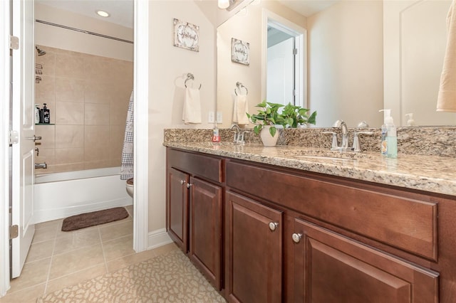 full bathroom featuring tile patterned flooring, toilet, shower / bath combo with shower curtain, double vanity, and a sink