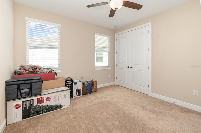 playroom featuring baseboards, carpet floors, and ceiling fan