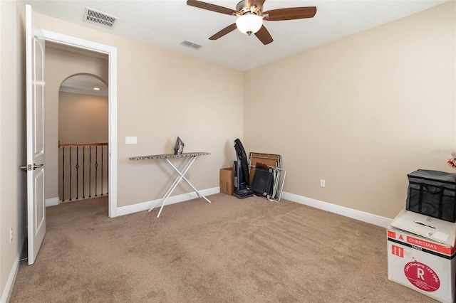 misc room featuring visible vents, baseboards, carpet flooring, and a ceiling fan