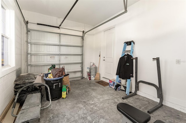 garage with concrete block wall and baseboards