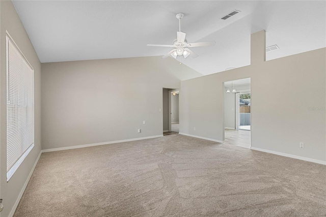 empty room featuring light carpet, visible vents, ceiling fan with notable chandelier, and baseboards