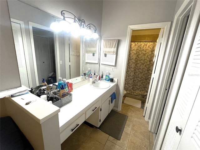 full bathroom with a shower with curtain, toilet, vanity, and tile patterned flooring