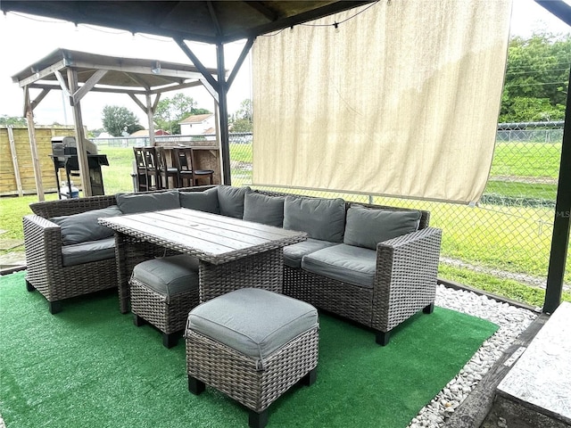 view of patio / terrace with a gazebo, area for grilling, outdoor lounge area, and fence