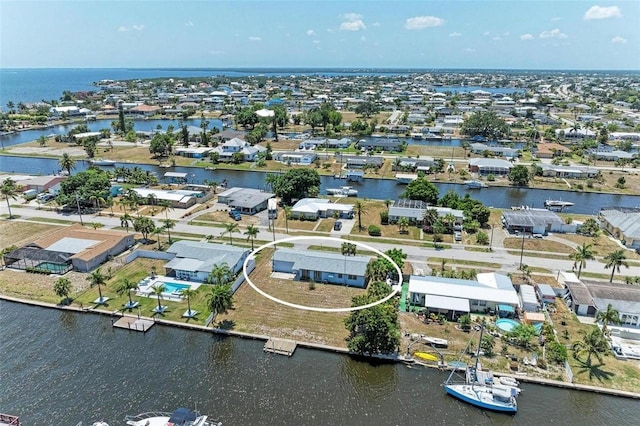 bird's eye view with a residential view and a water view