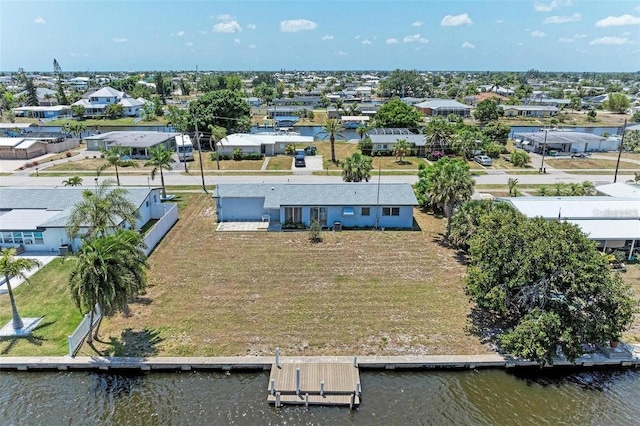 bird's eye view with a residential view and a water view