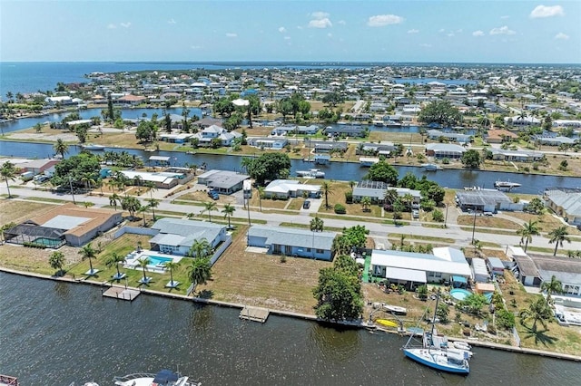 birds eye view of property with a residential view and a water view