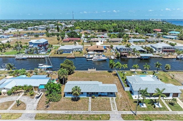 bird's eye view featuring a residential view and a water view