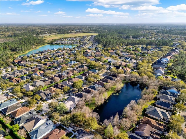 bird's eye view with a water view and a residential view