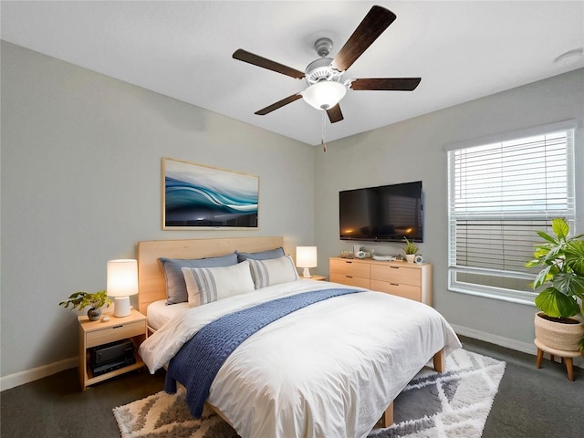 bedroom with baseboards and ceiling fan