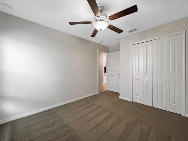 unfurnished bedroom with carpet, visible vents, baseboards, ceiling fan, and a closet