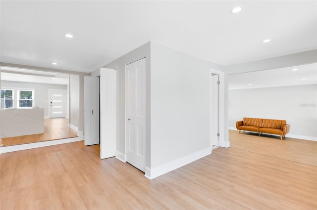 interior space with recessed lighting, baseboards, and light wood-style floors