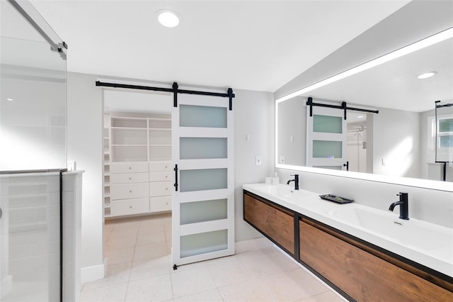 bathroom featuring tile patterned flooring, double vanity, recessed lighting, and a sink