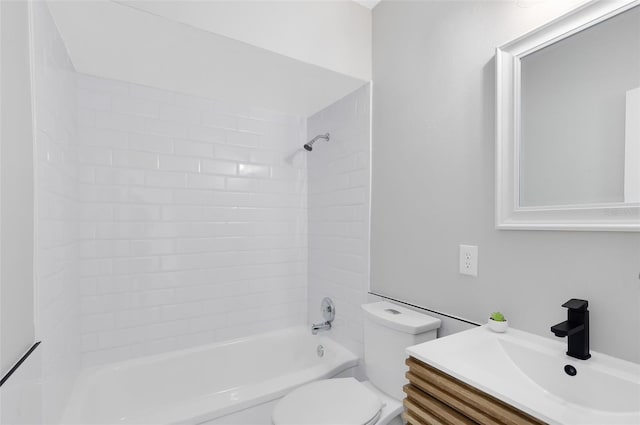 bathroom featuring shower / washtub combination, toilet, and vanity