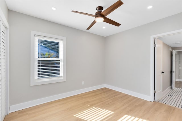 empty room with recessed lighting, baseboards, light wood-style floors, and ceiling fan