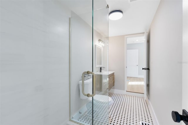 full bathroom with tile patterned floors, baseboards, vanity, and a shower stall