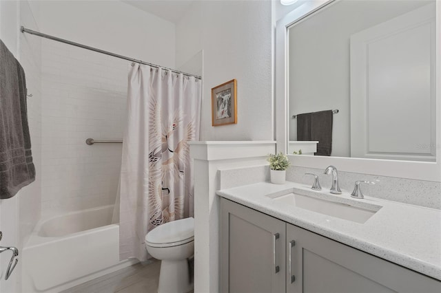 bathroom featuring vanity, toilet, and shower / tub combo with curtain