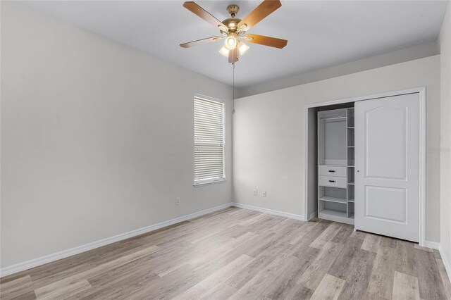 unfurnished bedroom featuring baseboards, light wood-type flooring, a closet, and ceiling fan