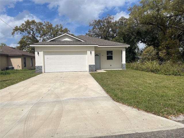 view of front of house featuring a front yard, stucco siding, a garage, stone siding, and driveway