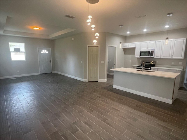 kitchen featuring visible vents, a sink, light countertops, electric range, and dark wood-style flooring