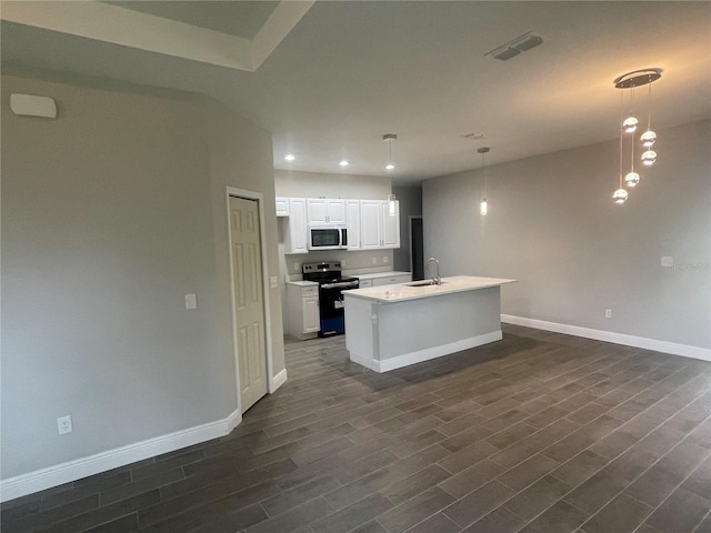 kitchen with stainless steel range with electric stovetop, visible vents, dark wood-style flooring, and a sink