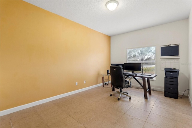 office area featuring light tile patterned floors, a textured ceiling, and baseboards