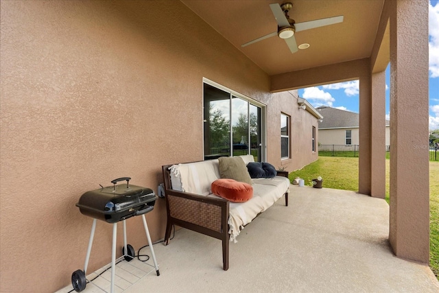 view of patio / terrace featuring a ceiling fan and fence