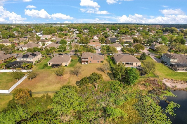 drone / aerial view featuring a residential view and a water view