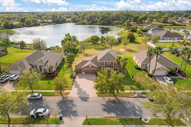 bird's eye view featuring a water view and a residential view