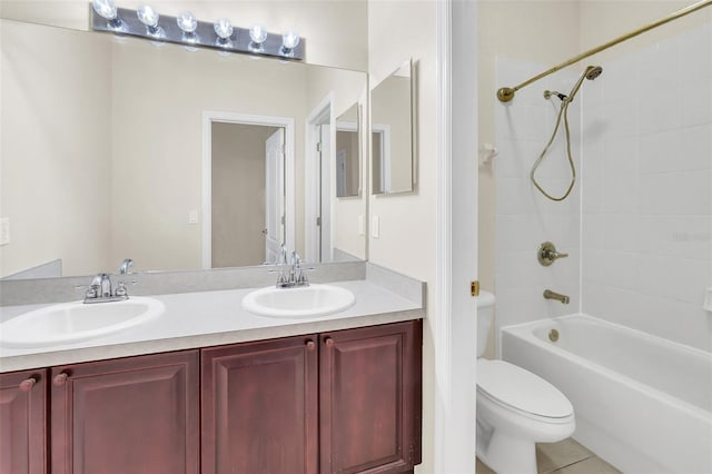 full bathroom featuring double vanity, toilet, shower / washtub combination, and a sink