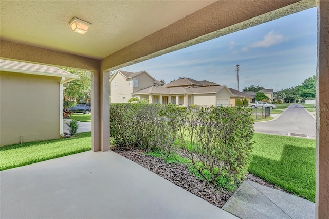 view of patio / terrace featuring a residential view and fence