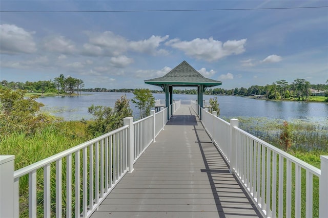 dock area with a gazebo and a water view