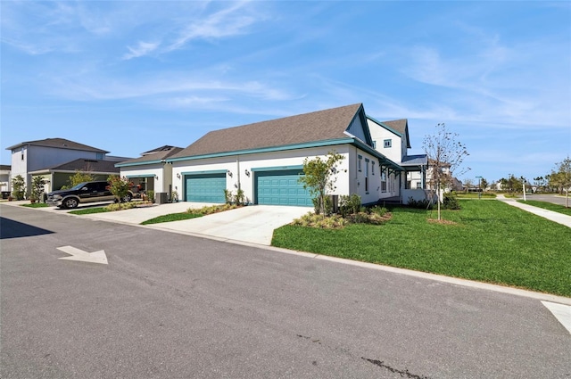 view of front facade featuring stucco siding, an attached garage, concrete driveway, and a front lawn